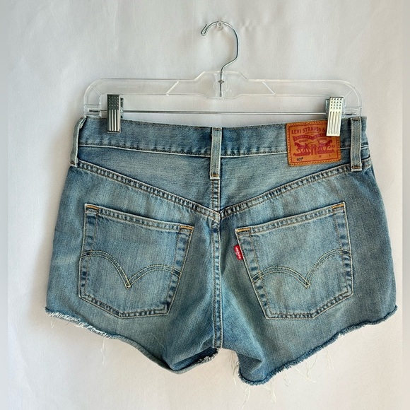 Levi's denim cut-off shorts with unique orange and teal pocket pattern - Picture 2 of 5